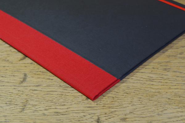 Black binder, red linen, elastic strap